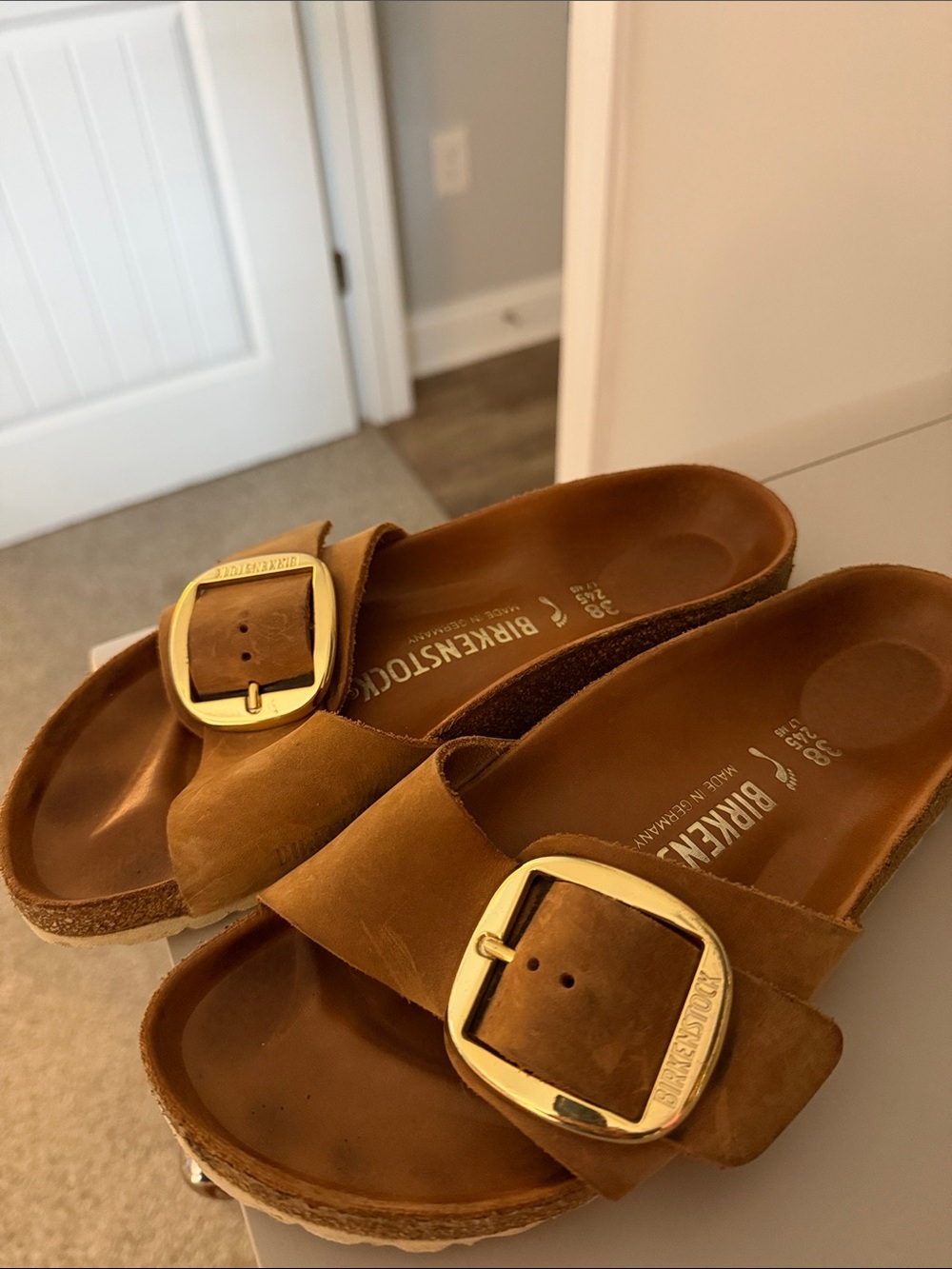 Birkenstock Tan Slide Sandals with Gold Buckles